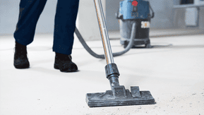 Industrial vacuum cleaning a floor